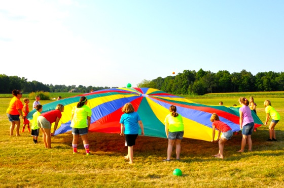 The parachute was not a "decoration," but it was a colorful mainstay at our Untamed Games Station all week. Kids LOVE parachute games.