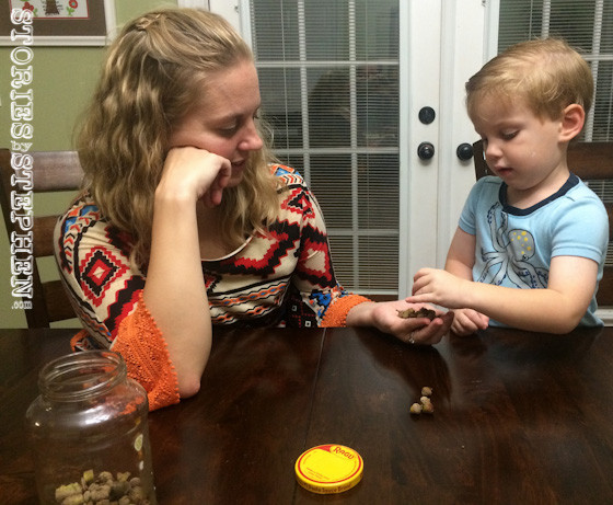 Jennifer patiently helped Sam count acorns.