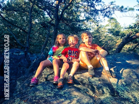 The kids climbed another boulder.