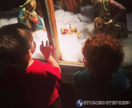 Sam and his cousin were enamored with little Baby Jesus in this Nativity.