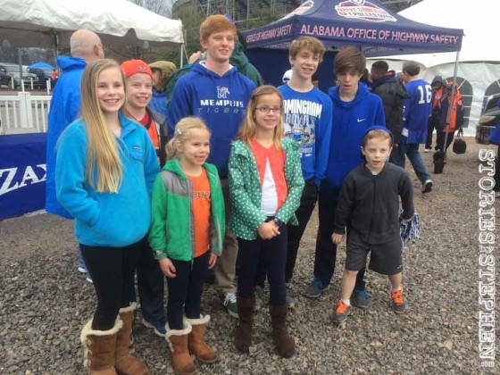 Will and his cousins at the Birmingham Bowl. Half the family was rooting for Memphis and half for Auburn.