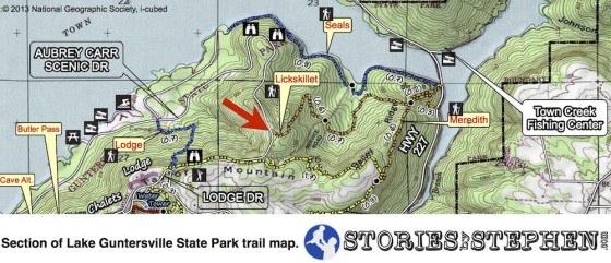 The top (west) end of the Lickskillet Trail meets the main road (Aubrey Carr Scenic Drive) in Lake Guntersville State Park.