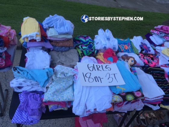 We had hundreds of kids clothing items for sale from our house. This is just 1 of the many tables of kids clothes. After several hours, we had sold countless grocery bags full of clothes (If you are selling clothes, always have grocery bags for customers.), and the clothes tables still looked like they had barely been touched.